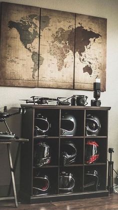 a bike helmet storage unit in front of a wall with a world map on it