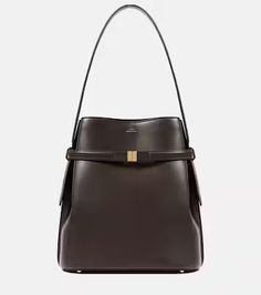 Leather bucket bag in brown - Toteme | Mytheresa High-end Bucket Satchel With Detachable Handle, High-end Satchel With Bucket Shape And Detachable Handle, High-end Bucket Bag With Detachable Strap For Travel, Luxury Brown Bucket Bag For Office, High-end Bucket Bag With Detachable Handle, High-end Travel Bucket Bag, High-end Leather Bucket Bag, Luxury Bucket Satchel With Removable Pouch, Designer Bucket Satchel With Handles