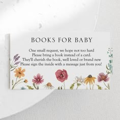 a card with flowers on it that says books for baby