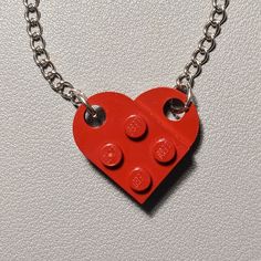 The necklace is handmade by AFOL (An Adult Fan of LEGO) using LEGO plates with a 20inch stainless steel linked chain. May have imperfections. Red Chain Charm Necklace For Gift, Red Adjustable Chain Necklace As A Gift, Red Pendant Chain Jewelry, Red Necklace With Adjustable Chain For Gift, Red Necklace With Adjustable Chain As Gift, Red Jewelry With Adjustable Chain And Round Pendant, Red Pendant Necklace With Chain, Red Chain Necklace With Lobster Clasp As Gift, Red Round Chain Jewelry