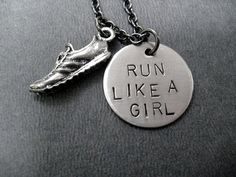 a necklace that says run like a girl with a shoe charm on the front and bottom