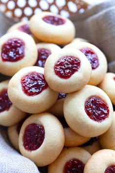 small cookies with jam on them in a basket