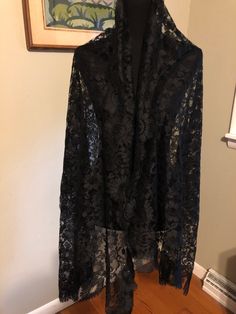 Beautiful black floral tulle lace shawl/wrap: This shawl is plain beautiful. It has squared edges and is in a tulle floral pattern. It measures 31x 74 in. Lace Shawl, Kokeshi Dolls, Beautiful Sweater, Shawl Wrap, Nesting Dolls, Tulle Lace, Long Black, Shawls And Wraps, Black Floral