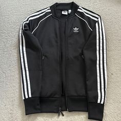 Never Used In Excellent Condition. Size: 2xs. Smoke- Free Home. Casual Fall Outerwear With Three Stripes, Casual Three Stripes Outerwear For Fall, Casual Three Stripes Fall Outerwear, Fitted Outerwear With Three Stripes For Fall, Fitted Three Stripes Outerwear For Fall, Adidas Black Outerwear With Three Stripes Branding, Adidas Long Sleeve Outerwear With Three Stripes, Black Sportswear Outerwear With Three Stripes, White Outerwear With Three Stripes Branding For Fall