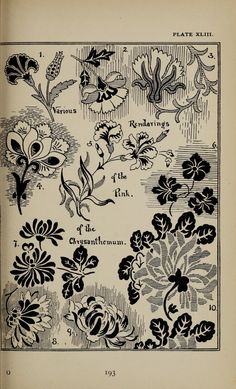 an old book with black and white floral designs on it's pages, including flowers