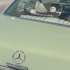 there is a mercedes car that has been parked in the parking lot for several years