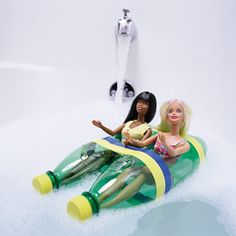 two barbie dolls are sitting on an inflatable tube