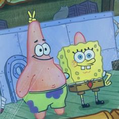 spongebob and patrick are standing next to each other