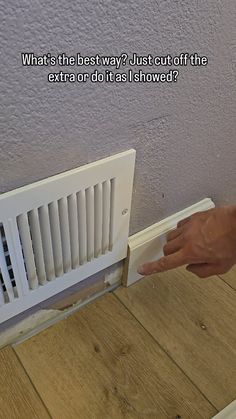 a person is pointing at the radiator on the wall next to it, which reads what's the best way? just cut off the extra or do it as shown?