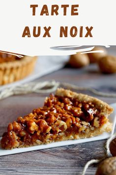 a slice of tarte aux noix on a white plate with the title above it