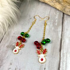 Get In The Seasonal Spirit With These Handmade Dangle Earrings They Feature Darling Enamel Reindeer Charms With Gold Trimming And I Added Gold Pl Chains And Metallic Metal Bells That Jingle Length Is About 3” Long Hypoallergenic Gold Pl French Wire Hooks Comes Gift Boxed Great For The Holiday Season Or As A Gift For Your Coworkers 9/1/24 Christmas Charm Earrings, Christmas Handmade Jewelry, Long Chain Earrings Gold, Holiday Jewelry Ideas, Christmas Earrings Handmade, Keychain Designs, Antique Silver Earrings, Gold Bead Earrings, Handmade Dangle Earrings