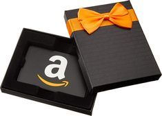 an orange bow tie on top of a black box with the amazon logo in it