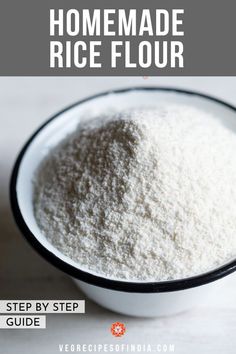 a white bowl filled with rice flour on top of a marble counter next to a spoon