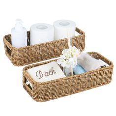 two wicker baskets with personalized towels and toiletries in them, one is brown