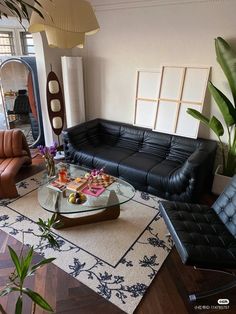 a living room filled with furniture and a large mirror