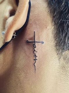 a man with a cross tattoo on his neck and behind the ear that says faith