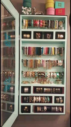 a large display case filled with lots of bracelets