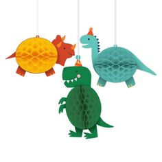 three paper animals hanging from strings in the shape of dinosaurs, one dinosaur is wearing a party hat