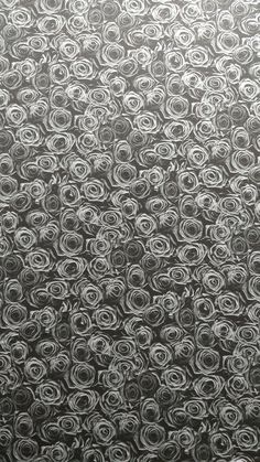 an abstract black and white photo with circles on the surface, as if it were made from paper