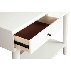 a white desk with drawers and a black drawer