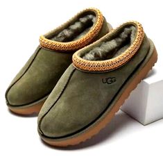 UGG TASMAN WOMEN'S SIZE 8 BURNT OLIVE SUEDE SHEEPSKIN CLASSIC SLIPPERS THIS ITEM SOLD OUT!! BRAND NEW NEVER WORN 100% AUTHENTIC GUARANTEED  WITH THE UGG HOLOGRAM ALWAYS LOCATED IN THE LEFT SHOE FOR AUTHENTICITY PLEASE REVIEW OUR FEEDBACK  USA TRUSTED SELLER  COMES IN ORIGINAL RETAIL PACKAGING  THAT INCLUDES ORIGINAL RETAIL BOX, AND ALL FACTORY LITERATURE.  Have questions/concerns? You can send us a message and we will respond within 24 hours or Less  Returns are acceptable within 30 days in unwo Green Tasman Uggs, Tasman Uggs, Ugg Slipper, Olive Shoes, Aesthetic Wardrobe, Boot Slippers, Tasman Slippers, Ugg Tasman Slippers, Classic Slippers