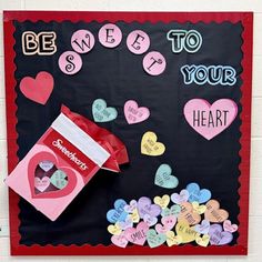 valentine's day bulletin board with hearts, candy and message to your heart on it