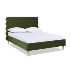 an image of a bed with green headboard and white pillows on the bottom side