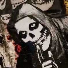 there are many skulls painted on the wall