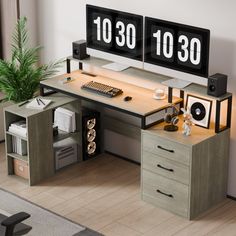 an office desk with two clocks on it