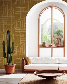 a living room filled with furniture and potted plants next to a large open window