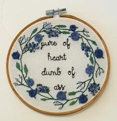 there is a embroidery on the wall that says, pure of heart drums of love