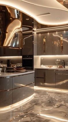 a modern kitchen with stainless steel appliances and marble counter tops is lit up at night