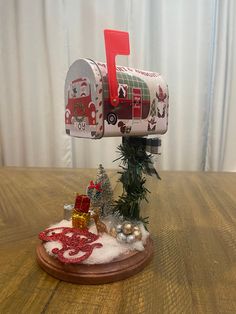 a mailbox decorated with christmas decorations and presents