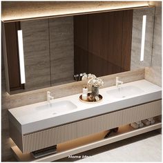 two white sinks sitting under a large mirror in a bathroom next to a wall mounted faucet