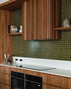 a kitchen with wooden cabinets and white counter tops, along with an oven in the center