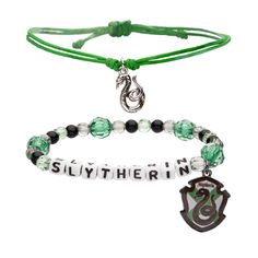 two bracelets with harry potter charms, one is green and the other is white