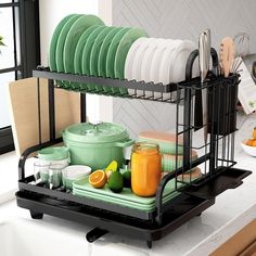 the dish rack is full of dishes and utensils