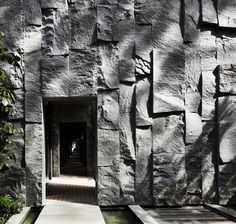 an entrance to a building made out of rocks