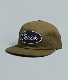 Meet Chuck. His likes include long walks along Charleston's Battery AND being your new favorite hat. Our "Chuck" Brushed Snapback features a perfectly worn in feel, front and back woven patch details, and adjustable plastic snapback closure.Made from washed 100% cotton twill fabric Adjustable plastic snapback closure Casual Snapback Hat With Flat Brim For Outdoor Activities, Casual Snapback Hat With Flat Brim For Outdoor, Casual Flat Brim Snapback Hat For Outdoor Activities, Casual Flat Brim Snapback Hat For Outdoor, Casual Snapback Hat With Logo Patch And Curved Brim, Adjustable Khaki Snapback Hat With Flat Bill, Casual Dad Hat With Logo Patch And Flat Bill, Adjustable Fitted Hat With Logo Patch And Curved Brim, Adjustable Fitted Hat With Logo Patch