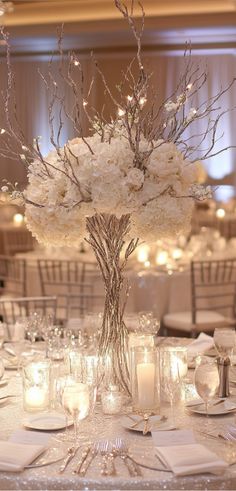 A beautifully styled white and silver winter wedding table setting with frosty white linens, shimmering silver accents, and elegant candlelight decor. Wedding Themes Tables, Winter Engagement Decorations, Snow Theme Wedding, 25th Wedding Anniversary Party Ideas Decorations Silver, Wedding Decor Themes Receptions, White Winter Wedding Decorations, February Wedding Aesthetic, Wedding Dark Color Schemes, Winter Ballroom Wedding