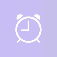 an alarm clock on a purple background