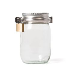 a glass jar with a metal lid and a wooden clip on the top is shown