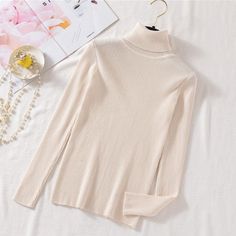 This is perfect for those who are looking for a clothing for a good price. It is fashionable, stylish, and it will look great on anyone who wears it. Do you wanahavit? One Size: Length: 53CM, Shoulder: 29-37CM, Bust: 62-92CM (Fit for Russian Size: 40-42; Europe Size 34-40; US Size: 4-10) Trendy Stretch Knit Top For Winter, Winter White Long Sleeve Turtleneck, Chic Non-stretch Long Sleeve Sweater, Knit Long Sleeve Turtleneck For Spring, Winter White Long Sleeve Top For Fall, Spring Cotton Turtleneck, Winter White Long Sleeve Turtleneck For Fall, Beige Stretch Sweater For Winter, Winter Beige Fine Knit Turtleneck