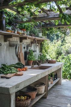 an outdoor kitchen with lots of vegetables on the counter