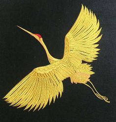 a yellow bird with long wings flying in the air on a black background, it appears to be made out of gold thread