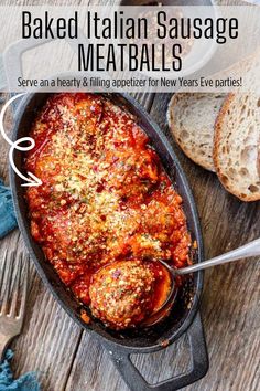 baked italian sausage meatballs in a skillet with bread on the side