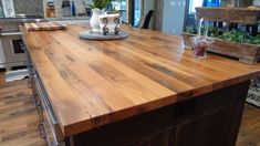 a kitchen island made out of wood and metal