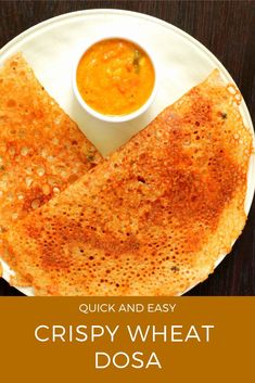 crispy wheat dosa on a plate with dipping sauce