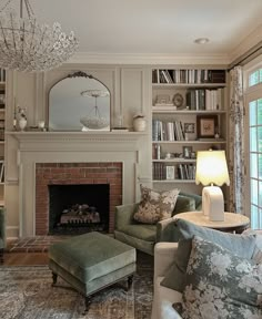 a living room filled with furniture and a fire place in front of a book shelf