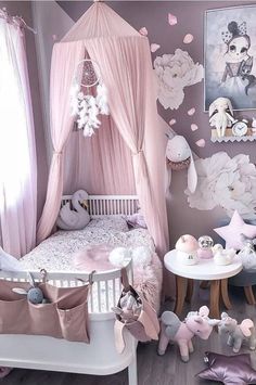 a baby's bedroom with pink and white decor